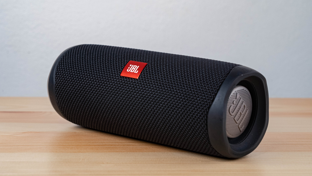 Black JBL Portable Speaker on Brown Wooden Table